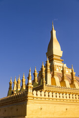 Pha That Luang bright golden stupa of buddhist temple in vientiane laos