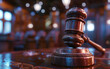 © CozyDigital - Judge's gavel in courtroom. Close-up photo. Seats are visible on the background. Justice concept and judicial system.