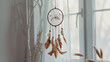 A dream catcher delicately hanging above the bed in the bedroom, fulfilling its dual role as decoration and a representation of harmony	
