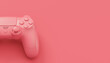 Video game joystick or gamepad in plain monochrome pink color background