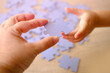 little child and mom playing together, parent teaches daughter to assemble puzzles, cognitive development through puzzle-solving, Parental Involvement in Learning