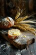 © Julia Jones - Sliced bread with butter and cheese, wheat ears on dark wooden background. Rustic food photography.