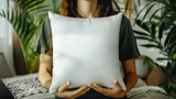 Fototapeta Konie - White Blank Polyester Pillow Mock Up Held In The Hands Of A Woman