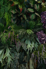 Wall Mural - Tropical green leaves background, Nature Wall Lush Foliage Leaf Texture, Vertical image.