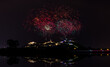 Fireworks show over Phra Nakhon Khiri Historical Park (Khao Wang), Petchaburi, Thailand, reflection of water for backgrounds,