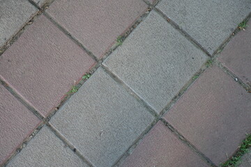 Wall Mural - Close view of stack bond brick like gray and pink concrete pavement