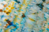 Fototapeta Tęcza - abstract pattern on silk fabric texture in blue, yellow, green colors