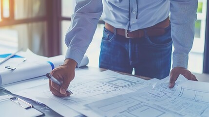 Poster - Close-up of a structural engineer reviewing construction plans, natural light, over-shoulder shot 