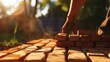 Laying bricks with skill, soft focus on background, clear foreground, late afternoon lighting 