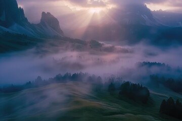 Poster - Sun shining through clouds over mountain range. Suitable for nature and landscape themes