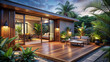 Modern style outdoor entertaining area with wooden deck and tropical plants surrounding the patio area