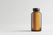 a brown pill jar on a gray background