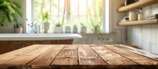 Wall Mural - Wooden table against a blurred background of a bathroom window and shelves.