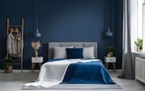Fototapeta Kwiaty - Empty-painted deep blue wall. Blue color bedding furniture and blank background.Bedroom interior trend 2024 year Modern luxury apricot room interior home designs.