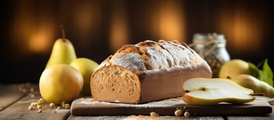 Leinwandbilder - A delicious pear bread is laid out on a wooden table with ample room for text in the composition s copy space image