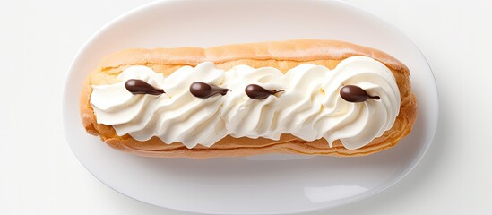 Fototapete - A cream filled eclair is seen from above in a photo with ample space for additional elements emphasizing its sweetness and inviting quality