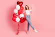 © deagreez - Full size photo of lovely young woman balloons hold champagne dressed stylish white garment hairdo isolated on pink color background