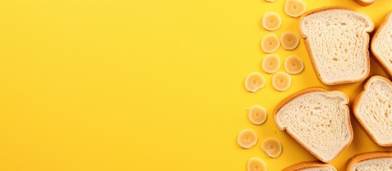 Poster - A breakfast themed copy space image showcasing a vibrant yellow background adorned with multiple slices of toasted bread observed from a top down perspective