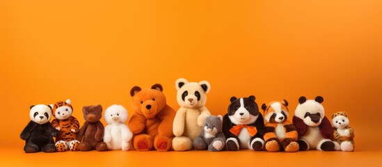 Wall Mural - A copy space image of adorable plush animals arranged against a vibrant orange backdrop