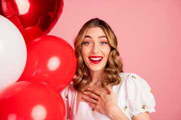 Poster - Photo portrait of lovely woman balloons amazed reaction dressed stylish white garment hairdo isolated on pink color background