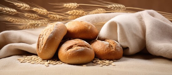 Poster - A copy space image featuring bread rolls and seeds placed on a textured burlap background providing ample white space for adding text