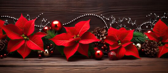 Poster - A festive Christmas decoration featuring vibrant red Poinsettia flowers a branch of fir and embellishments like red balls and beads set against a wooden background Perfect as a New Year and Christmas