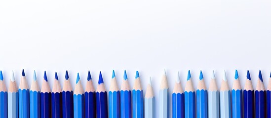 Poster - A blue pencil can be seen in the middle of a white background in this copy space image