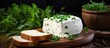 A copy space image of curd cheese is presented on a rustic wooden cutting board along with rye bread and a garnish of fresh herbs