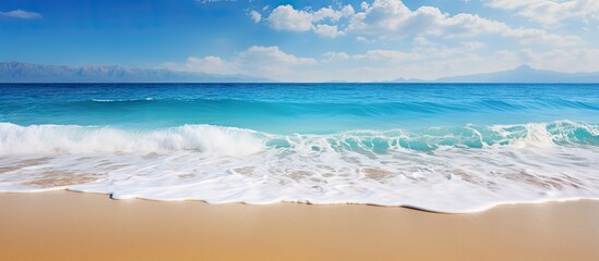 Aufkleber - A captivating seascape with a mesmerizing blue sea sandy shore and majestic waves The stunning beauty of nature surrounds this image perfect for wallpaper or background with ample copy space