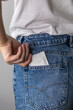 © kanashkin - Condoms in jeans pocket. Prevent infection. World AIDS Day. The concept of sexual health.
