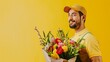 A man in a yellow shirt is holding a bouquet of flowers