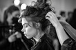 © YouAreBeautiful - Hairstylists prepare fashion models with complex hairstyles for a major runway show - complementing high-fashion looks