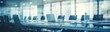 Contemporary Boardroom: Conference Table with Blue Chairs Set Against Glass Wall