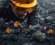 a closeup of a An American miner wearing a yellow helmet and goggles is carefully picking up an orange crystal rock from the ground, surrounded by dark rocks, Perspective view, cinematic