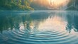 Sunrise over calm lake with forest reflection and ripples on water surface.