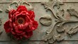 Red floral sculpture on textured ornate background. Decorative art and design concept.