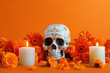 Day of the Dead skull with orange marigold flowers