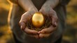 © Natalia - Close-up of hands holding a golden egg nestled in a small nest, symbolizing wealth and investment