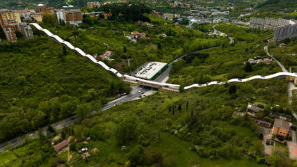 Wall Mural - Aerial view of the equipped bridge that crosses Potenza, in Basilicata, Italy. It is a long system of escalators and an important infrastructure of the city.