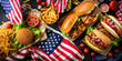 Picnic table with delicious food, burgers, hot dogs, french fries and condiments for USA 4th July Independence day, top view