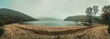 Beautiful panoramic view with lake, beach, trees, valley and rocky steep mountain. Bad Depressing weather. Lough Dan lake in Wicklow Mountains, Ireland