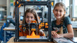 © Liliya - a little girls using 3D printer in classroom at school