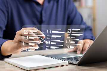 Canvas Print - Digital business performance monitoring survey filling with tablet and laptop, Businessman enhancing business performance with comprehensive online survey checklist, Technology in education learning.