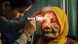A woman is getting her eyes checked by a doctor