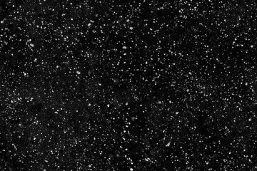 dark textured background resembling outer space with scattered white dots