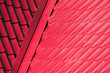 Red metal shingles, inner corner of roof slopes, abstract background