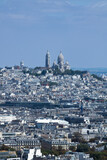 Fototapeta Paryż - Sacré-Cœur is a basilica on top of Montmartre hill (Paris, France). Panoramic view of the roofs of the buildings around the Tour Eiffel, Paris, France