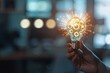© SKIMP Art - A hand holds a light bulb with gears inside representing a concept of digital innovation and technology on a blurred office background Generative AI