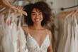 Beautiful young afro american bride is trying on her wedding dress in the dressing room