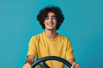 Aufkleber - A man in a yellow shirt holding a steering wheel. Suitable for automotive concepts